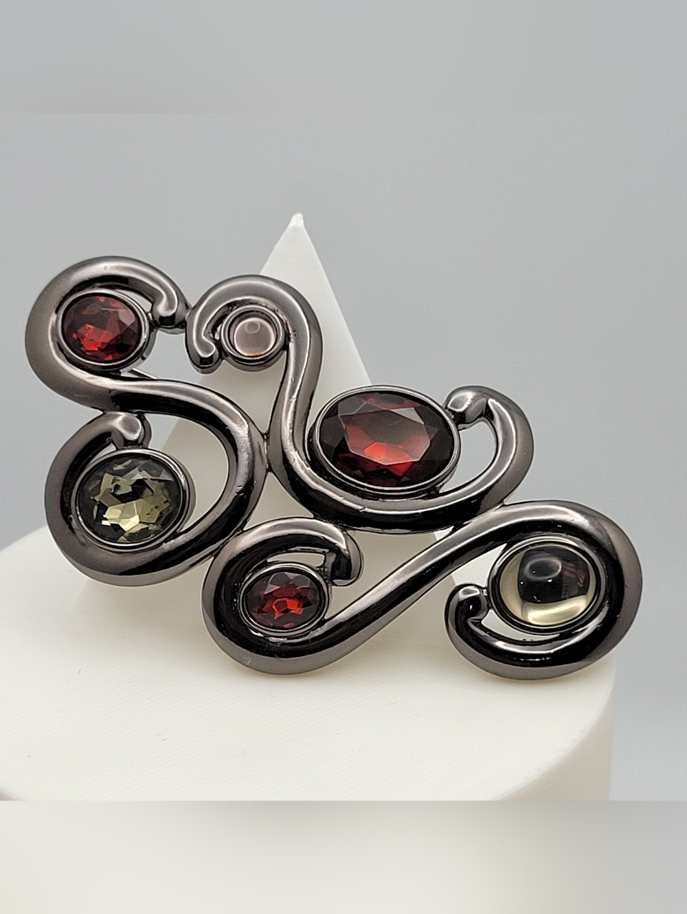 Gunmetal Swirl Brooch with Deep Red and Olive Crystals